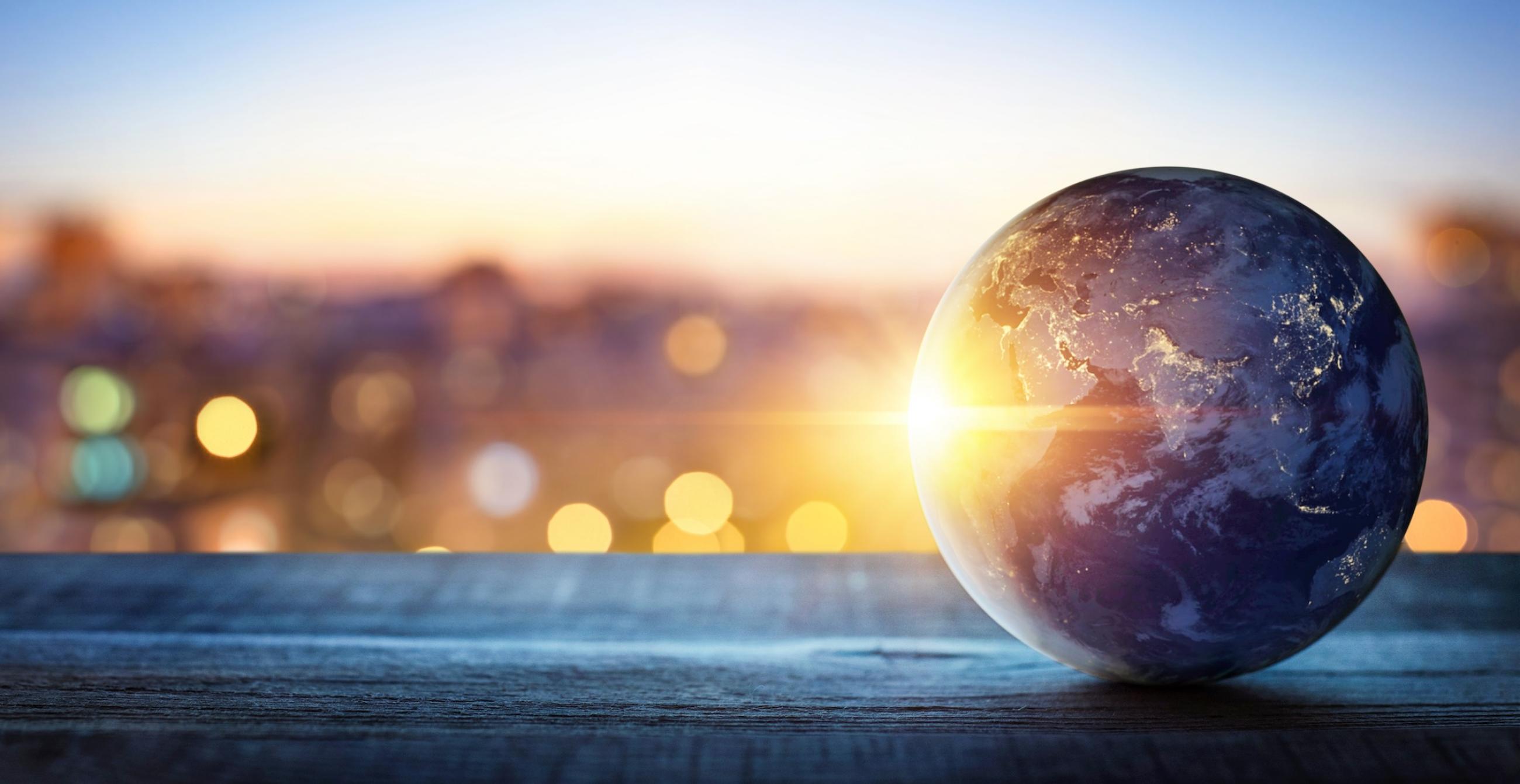 Rendering of a globe in front of a city